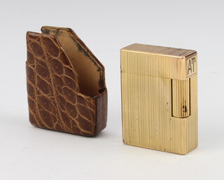 A lady's Dupont gold plated petrol cigarette lighter in leather holder 