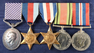 A Distinguished Flying medal group of 5 medals to 1264568 Flight Sergeant A F Lacey RAF comprising George VI issue Distinguished Flying medal, 39-45 Star, Defence and War medal together with South African Air Force Observers or Air Gunners log book to 156 Squadron with dates from August 1943 to June 1945   