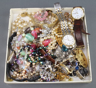 A quantity of vintage costume jewellery and watches
