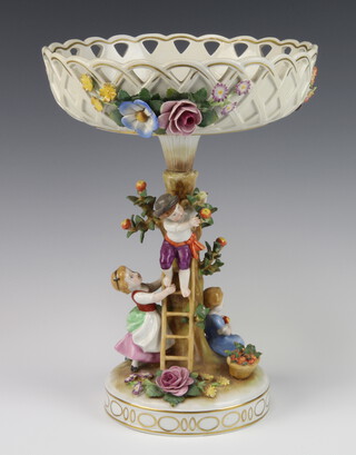 A 20th Century German porcelain centrepiece with pierced and applied floral decoration, the base with children beneath an apple tree, 30cm 