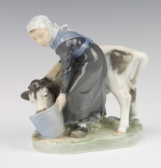A Royal Copenhagen figure of a milkmaid with cow, 779 17cm 