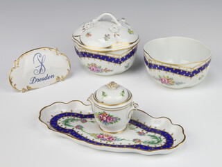 A modern Dresden porcelain lidded bowl and cover decorated with flowers 12cm, a ditto bowl 6cm, an ink stand 9cm together with a shop display plaque 6cm 