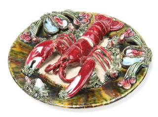 A Portuguese Palissy style wall plaque decorated with a lobster and shellfish 33cm 