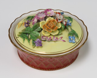 A 20th Century Dresden porcelain circular box and cover with applied flowers 14cm 