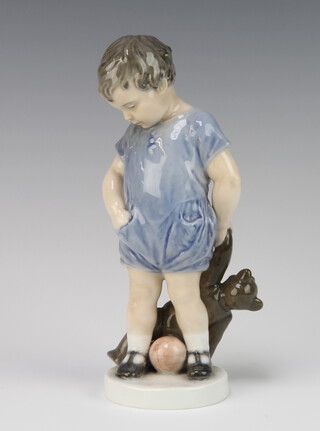 A Royal Copenhagen figure of a standing boy holding a teddybear 3468 19cm 