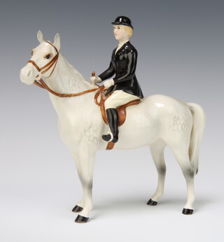 A Beswick figure "Huntswoman" style 2 with rocking horse grey body and black gloss jacket, 21cm, modelled by Arthur Greddington 