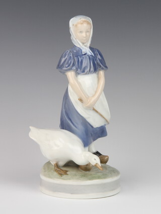 A Royal Copenhagen figure of a goose girl raised on a round base 529 23cm 