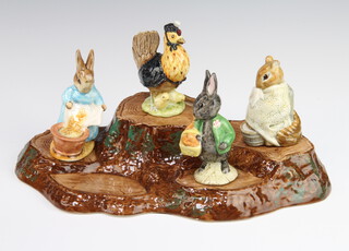 Four Beswick Beatrix Potter figures - Little Black Rabbit 10cm, Chippy Hackee 9cm, Sally Henny Penny 10cm, Cecily Parsley 10cm together with a Beswick rustic stand 32cm  
