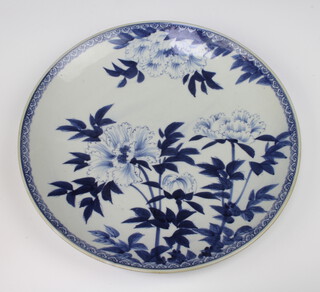 A 19th Century Japanese blue and white charger decorated chrysanthemums 41cm, base with stilt marks 