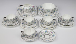 A Shelley 21 piece tea service comprising 2 square twin handled plates, 6 tea plates (3 cracked), sugar bowl (cracked), cream jug, 5 cups, 6 saucers (1 cracked), bases marked Shelley 11477 