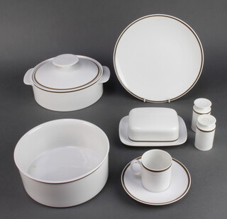 A 75 piece Thomas white patterned dinner service comprising oval meat plate, 5 large dinner plates, 4 medium plates (1 cracked) 5 side plates, 14 tea plates (1 cracked), 4 pudding bowls (1 cracked, 1 chipped), 6 bowls, vegetable tureen and cover, twin spouted sauce boat, butter dish and cover, salt and pepper pot, lidded sugar bowl, cream jug, 9 coffee cans, 8 saucers, 3 large coffee cans, 6 twin handled soup bowls, 3 soup saucers, circular bowl together with 4 white Denby bowls 