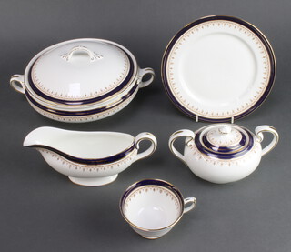A 72 piece Aynsley Leighton pattern dinner service comprising 3 twin handled vegetable tureens, additional tureen lid, oval bowl, meat platter, 3 soup bowls (1 cracked), 8 dessert bowls, 12 dinner plates (1 cracked to edge, all with contact marks), 14 side plates (with contact marks), 13 tea plates, sugar bowl and cream jug (both seconds), 5 cups and saucers (3 cups seconds) 