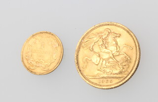 A sovereign 1965 together with an 1862 1 dollar coin 