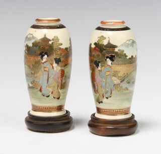 A pair of Japanese Satsuma vases decorated pagoda, court figures, Mount Fuji, the base with seal mark 10cm x 3.5cm 
