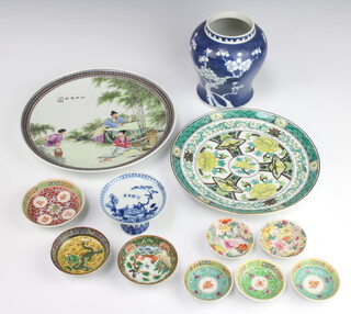 A Chinese blue and white circular stepped bowl 7cm h x 10cm diam., a circular Chinese plate decorated figures 10.5cm, a Japanese famille verte plate 9.5cm, blue and white vase with prunus decoration 16cm x 10cm and 8 small dishes (1 with chip to base) 