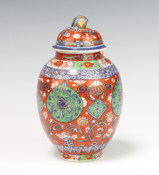 A Chinese Imari baluster shaped urn and cover with panelled decoration 17cm h x 5cm (chip to lid and top of vase) 