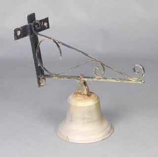 A gilt metal bell 17cm x 32cm with iron bracket 30cm x 24cm x 58cm (the bell has no clapper) 