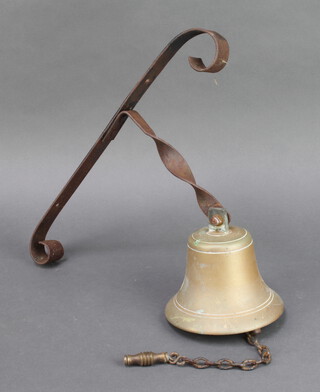 A brass bell 15cm x 15cm on a wrought iron bracket 41cm x 21cm 