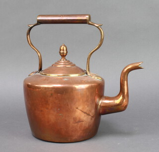 A circular Victorian copper kettle with acorn finial 30cm x 15cm 