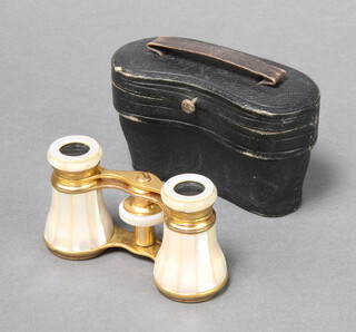 A pair of French gilt metal and mother of pearl opera glasses marked Deraisme FT Paris in a leather carrying case 