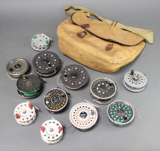 A Shakespeare 2756 centre pin trout fishing reel and spare spool, ditto Daiwa reel and spool, ditto dragonfly 80, ditto rimfly, a Haakon Oslo Norway centre pin reel, 3 other centrepin fishing reels together with a canvas and leather fishing bag  