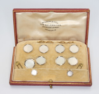 An Edwardian 9ct yellow gold and mother of pearl cased dress set comprising pair of cufflinks and 6 studs