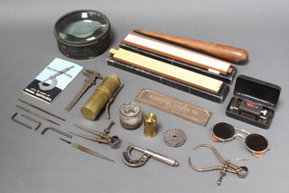 A cylindrical brass burner 10cm x 4cm, a lignum vitae reamer 33cm x 4cm, 2 slide rules and a collection of various precision instruments 