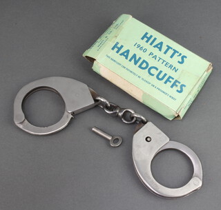 A pair of Hiatt's 1960 patent handcuffs complete with key, box and instructions 
