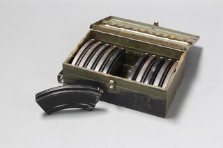 A rectangular metal twin handled box 13cm h x 39cm w x 24cm d containing 11 bren gun magazines 