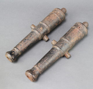 A pair of 19th Century iron signalling canons the barrels marked II 38cm l x 12cm w, the bore of the barrel 2cm 