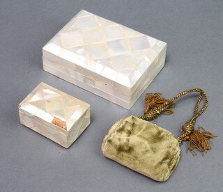 A rectangular mother of pearl trinket box with hinged lid 5cm x 13cm x 9.5cm, 1 other 3cm x 7cm x 4cm (section of m.o.p. missing to the lid) together with a Victorian plush purse 5cm x 8cm x 1cm 