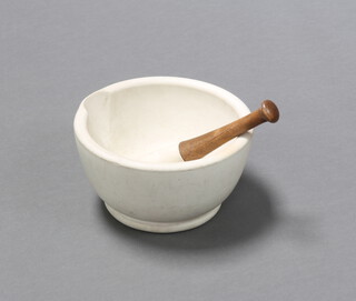 A pestle and mortar, the mortar marked 9, 14cm h x 25cm diam, the wooden handled pestle head marked 5, 23cm x 4cm 