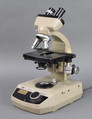A Vickers electric binocular microscope, the reverse marked 200 230 220-250 volts 
