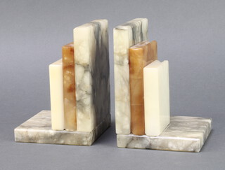 A pair of Art Deco alabaster bookends in the form of 3 graduated books 14cm h x 10cm w x 9.5cm d 