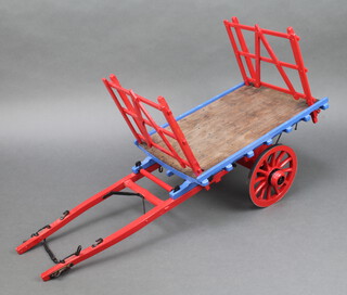 A wooden model of a Devon flatbed wagon 17cm h x 67cm l x 22cm w