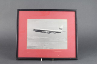 Four black and white photographs of Laker airliners, framed 18cm x 24cm 