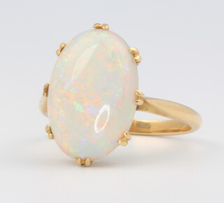 A 9ct yellow gold oval opal ring, size N, 4.3 grams 