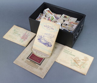 Two albums of cigarette cards, an album of Wills cigarette cards together with quantity of loose cigarette cards 

