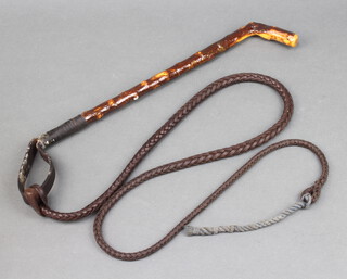 A hunting whip with leather thong and lash 