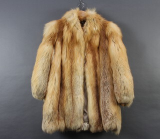 A lady's quarter length fox fur coat, size 14 