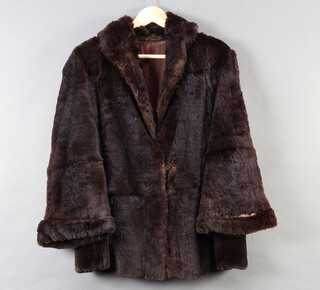 A lady's quarter length black fur coat (some molting) 