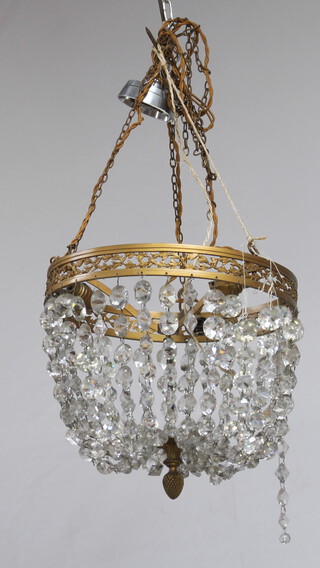 A circular gilt metal bag shaped light fitting hung lozenges 24cm x 30cm 