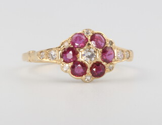 A Victorian style 15ct yellow gold ruby and diamond cluster ring 1.9 grams, size N  