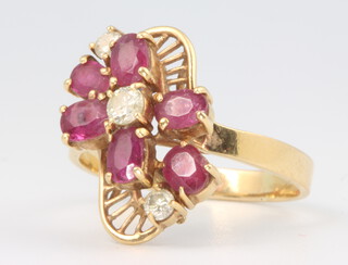 An 18ct ruby and diamond cocktail ring, 6 grams, size S
