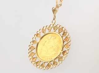 An 1896 half sovereign in a 6 gram 9ct mount and chain 