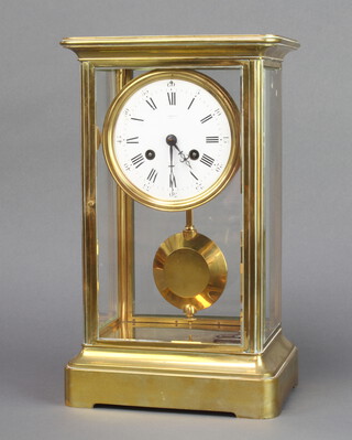 Edmonds Paris, a French 19th Century 8 day striking 4 glass mantel clock, the 11cm circular dial marked Edmonds Paris, Baker Street London, striking on a bell, the back plate marked 725, contained in a gilt metal and glass case 34cm h x 20cm w x 16cm d 