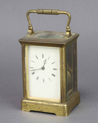 A 19th Century French 8 day carriage alarm clock with enamelled dial and Roman numerals contained in a gilt metal case, complete with key 12cm h x 8cm w x 7cm d 