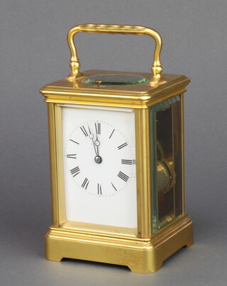 A 20th Century 8 day French quarter repeating carriage clock with enamelled dial and Roman numerals, the back plate marked CV20985, complete with key  12cm h x 18cm w x 7cm d  