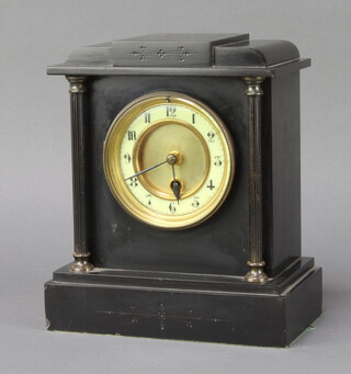 A 19th Century French timepiece with enamelled dial and Arabic numerals contained in a black marble case complete with pendulum and key 24cm h x 20cm w x 12cm d 
