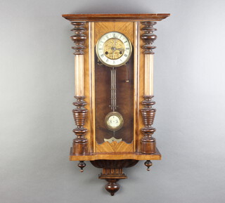 A Vienna style Art Nouveau regulator, the 13cm enamelled dial with Roman numerals, having a grid iron pendulum, striking on a gong, contained in a walnut case 76cm h x 41cm w x 19cm d 
